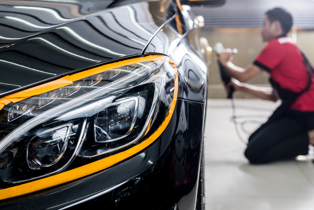 auto detailing business led by a man doing a black car